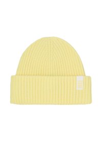 Bonnet jaune en tricot avec une texture côtelée, doté d'un revers et d'une petite étiquette blanche portant l'inscription « seaSIDE ».