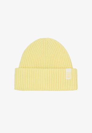 Yellow knitted beanie hat with a ribbed texture, featuring a fold-over cuff and a small white tag labeled “seaSIDE.”