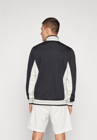 Fila JACKET BJÖRN - Jakna za treniranje - black/white alyssum