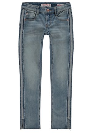 Light blue denim jeans with a slim fit, featuring frayed edges, side zippers, and distressed detailing along the outer seams.