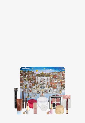 Make-up-Set in einer rechteckigen Box mit einem bunten Stadtansicht-Design. Enthält Lippenstifte, Lidschatten, Bronzer und Applikatoren.