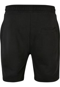 Shorts de sport noirs avec une taille élastique, une poche arrière et une texture en coton lisse. Design simple sans motifs ni accents.