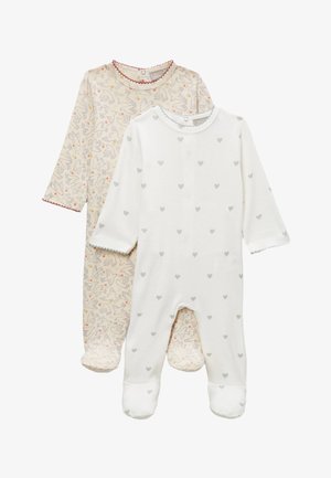 Deux grenouillères pour bébé, l'une blanche avec de petits cœurs gris, l'autre beige avec un motif d'oiseau et de fleurs, toutes deux à manches longues et avec des couvre-pieds.