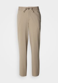 Pantaloni beige realizzati in un tessuto morbido, con vita con coulisse e vestibilità comoda, gambe dritte e senza tasche visibili.