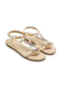 Sandalo con perline che presenta una suola in pelle beige e una cinturino alla caviglia regolabile. La parte superiore è decorata con perline colorate in rosa, giallo, argento e viola.