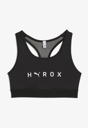 Zwarte sport-bh met racerback ontwerp, witte "HAROX" tekst en een Puma-logo dat de letter A in het midden aan de voorkant vervangt.