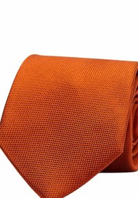 Texturerat orange slips med rullad form, som har ett vävt mönster med en något glansig finish och en spetsig ända. Perfekt för formella tillfällen.