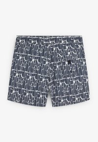 Shorts de bain navy avec un motif géométrique blanc, taille élastique et poche latérale. Fabriqués en tissu léger et à séchage rapide.