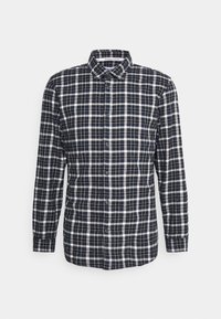 Navy and white plaid long-sleeve shirt made from organic cotton. Features a button-down collar and front button closure. Relaxed fit design.