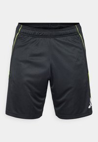 Shorts de sport noirs en tissu léger, avec des accents verts sur les côtés et un logo blanc en bas à gauche. Taille élastique pour plus de confort.