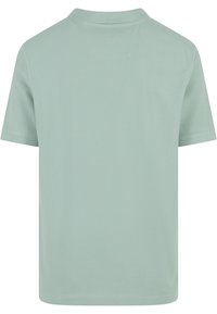 Ljust grön kortärmad t-shirt i mjukt material, med klassisk krage och en enkel, slät textur utan mönster.