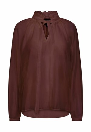 Blouse marron transparente à manches longues avec un col haut à volants et un détail de lien à l'encolure en forme de goutte, coupe ample et coutures d'épaules froncées.