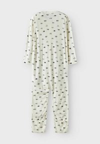 Ljusgrön pyjamasoverall med långa ärmar, prydd med ett upprepat mönster av små fordon och korgar. Mjuk kvalitet, avslappnad passform, elastiska muddar.