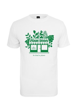 Valkoinen t-paita, jossa on vihreä graafinen kuva kasvikaupasta, jota ympäröivät lehdet, ja teksti "ole ystävällinen kasveille" alapuolella.