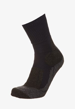 Calza nera lavorata a maglia con risvolto a costine, tallone e punta rinforzati in un grigio scuro a contrasto, caratterizzata da una morbida texture e un design di lunghezza media fino al polpaccio.