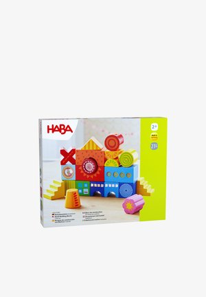 Multicolored building block set featuring various shapes, including squares, circles, and triangles, in vibrant hues, with patterned details.