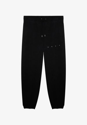 Pantalones deportivos negros con cintura y puños elásticos, cordón ajustable y pequeño logotipo blanco "HUGO" en la parte superior del muslo.