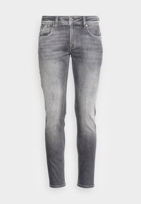 Grå denimjeans med en blekt tvätt, smal passform, femfickorsdesign och klassisk knappstängning. Slitna detaljer på tyget.
