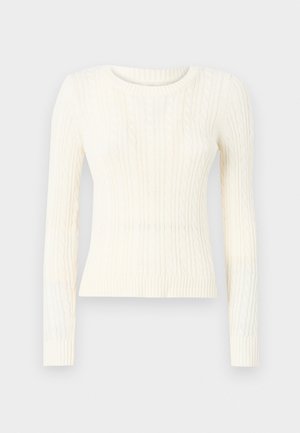 Pull en maille torsadée crème avec manches longues, col rond et ourlet côtelé. La texture du tissu présente des motifs en relief sur l'ensemble.