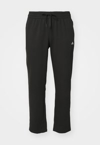 Svarta sweatpants i mjukt tyg, med elastisk midja och dragsko, rak bendesign och en liten logotypdetalj.