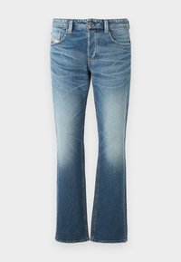 Jean en denim bleu avec un design évasé, présentant un lavage délavé, cinq poches et des coutures contrastantes. Fermeture par bouton à la taille.