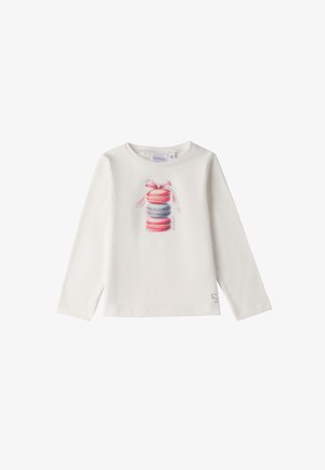 Camisa blanca de manga larga con un gráfico colorido de un macaron con un lazo. Tejido suave con un escote redondo y dobladillo recto.