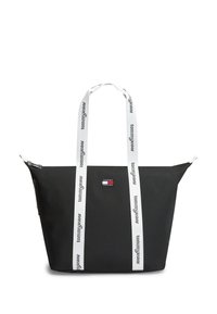 Μαύρη τσάντα tote με διαγώνια υφή, λευκές λουριά με την επωνυμία "tommyjeans" και μικρό λογότυπο μπροστά. Κλείσιμο με φερμουάρ στην κορυφή.