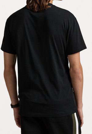 Black cotton T-shirt featuring a crew neckline and short sleeves, with a smooth texture and a relaxed fit. Back view shows no additional details.