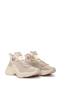 Beige athletic shoes with a textured knit upper, featuring a sparkling accent on the side and a rubber sole for support.
