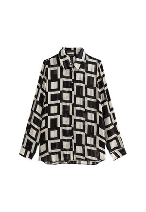 Blouse met lange mouwen en knopen, met zwart-wit geometrisch vierkant patroon en kraag op een witte achtergrond.