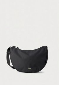 Mustast sünteetilisest materjalist ümarate vormidega põlvekott, reguleeritava rihma ja esiküljel väikese rohelise logo aksendiga. Sile tekstuur.