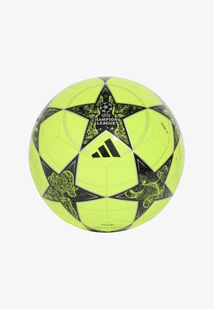 Pallone da calcio giallo brillante con stella nera e logo UEFA Champions League. Presenta dettagli grafici neri e superficie testurizzata. Taglia 5.