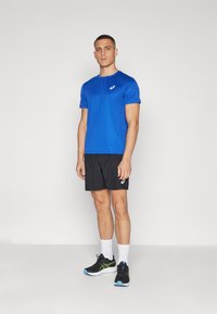 ASICS CORE TOP - Sports T-shirts - blue