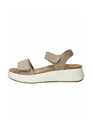 Beige suède sandaal met open teen, verstelbare bandjes en dikke witte gewatteerde zool, ontworpen voor comfort en casual gebruik.