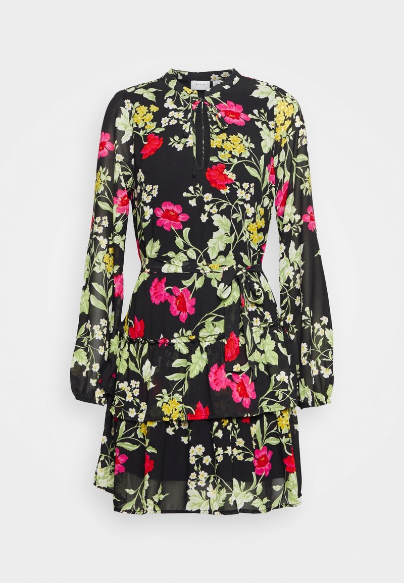 Robe noire à manches longues à fleurs rose, rouge, jaune et blanche, taille nouée, jupe à volants et encolure keyhole avec détail noué.