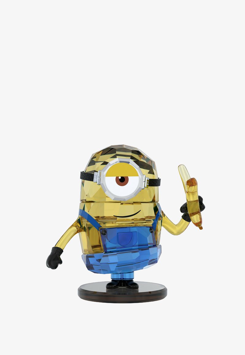 A colorful, crystalline Minion figure holds a banana, wearing blue overalls and black gloves, set against a white background.