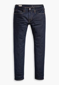 Jean slim bleu foncé avec coutures orange, design cinq poches et fermeture par bouton, présenté sur fond blanc.