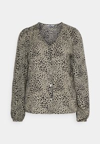 Beige knappete bluse med svart prikket mønster, lange puffermer og v-hals. Laget av lett, glatt stoff.