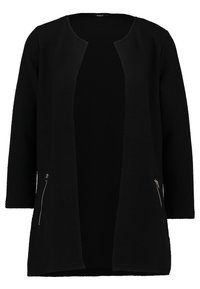 Svart cardigan gjord av texturerat tyg, öppen frontdesign, långa ärmar och två dragkedjefickor på sidan.