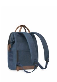 Navy blue backpack made of durable fabric, featuring a top handle, adjustable straps, and brown leather accents. Zipper closure on the side.