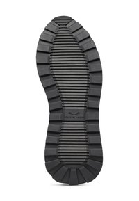 Soletta in gomma nera con profonde scanalature e rilievi, con un logo centrale impresso con la scritta "VOILE BLANCHE." Superficie testurizzata per una buona aderenza.