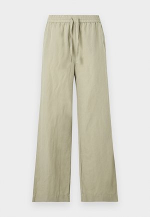 Ανοιχτό μπεζ παντελόνια φαρδύ με ελαστική μέση και κορδόνι, επίπεδη μπροστινή όψη και πλαϊνές τσέπες, εμφανίζονται σε λευκό φόντο.
