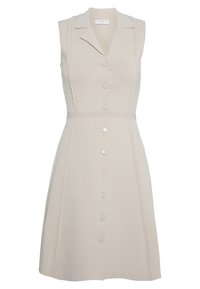 Abito beige senza maniche con colletto, bottoni frontali e dettagli laterali strutturati. Realizzato in tessuto a maglia con vita aderente.