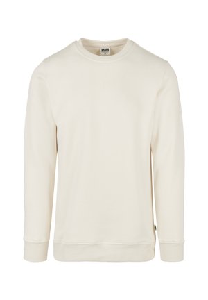 Krém színű pulóver puha anyagból. Kerek nyakkivágással, passzés hosszú ujjal és varrott szegéllyel rendelkezik. Minimalista, minták nélküli kialakítás.