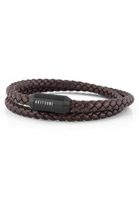 Braided dark brown leather bracelet featuring a cylindrical black metal clasp with the brand name “AKITSUNE” engraved.
