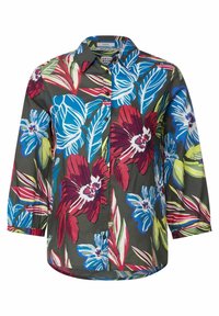 Camisa de botones con cuello, mangas largas y un gran estampado floral tropical en rojo, azul y verde sobre fondo oscuro.