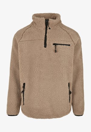 Beige fleece-pullover med høj krave, lynlås brystlomme og sidelommer med lynlås. Tekstureret stof med en blød, varm finish.