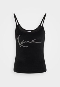 Svart ärmlös topp i mjuk sammet, med en design av en rhinestone-logotyp på framsidan. Slät textur med figursydd silhuett.