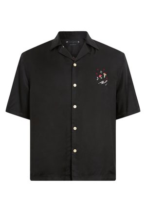 Chemise noire à manches courtes en tissu lisse, dotée d'une fermeture à boutons sur le devant et d'un design coloré brodé sur le côté gauche de la poitrine.