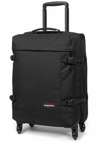 Black rolling suitcase with a textured durable fabric, telescopic handle, side compression straps, and smooth-rolling wheels. Eastpak logo displayed.